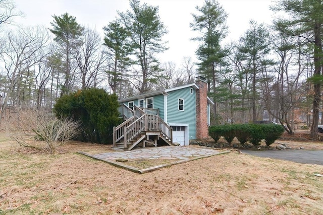 2 Marlboro Rd, Georgetown, MA 01833 - rear view of house with a chimney and stairway