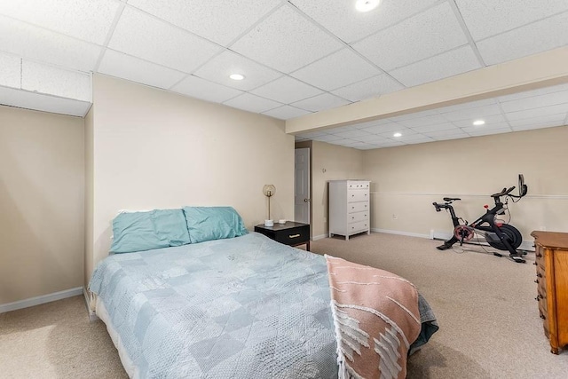 bedroom with carpet, a paneled ceiling, baseboards, and recessed lighting