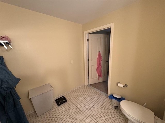 bathroom featuring tile patterned flooring and toilet