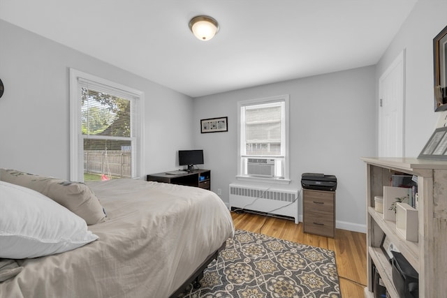 1 Walter St, Worcester, MA 01609 - bedroom featuring radiator, multiple windows, cooling unit, and light wood-type flooring