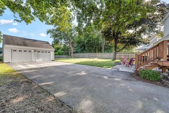 1 Walter St, Worcester, MA 01609 - view of yard featuring a detached garage, stairway, an outbuilding, and a deck