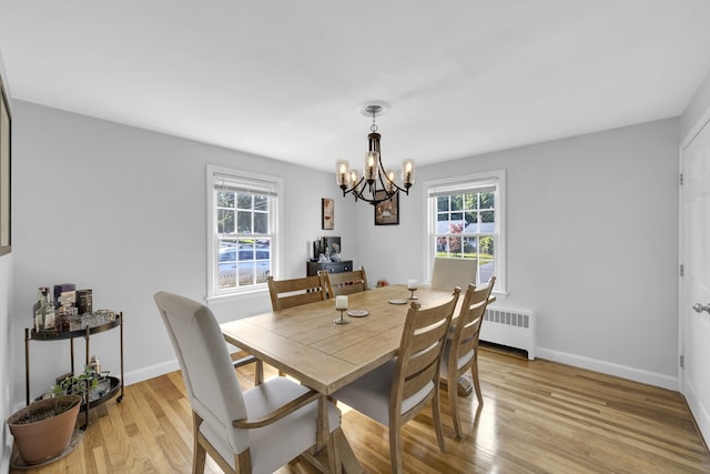 1 Walter St, Worcester, MA 01609 - dining room with radiator heating unit, a chandelier, and light wood-style floors
