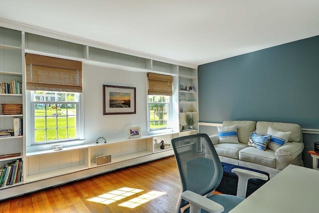 47 Fallon Dr, Westport, MA 02790 - office area with plenty of natural light, wood finished floors, and a baseboard radiator