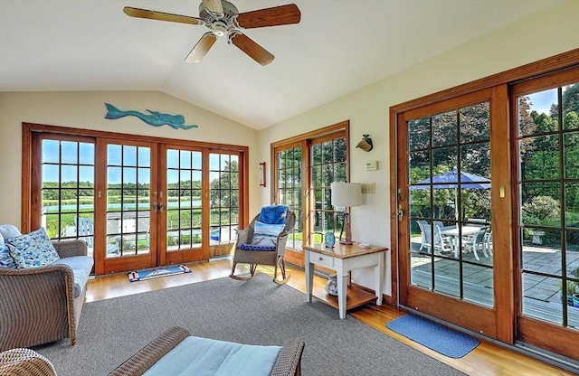 47 Fallon Dr, Westport, MA 02790 - doorway to outside featuring lofted ceiling, wood finished floors, and ceiling fan