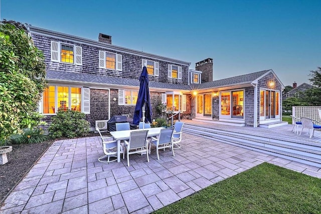 47 Fallon Dr, Westport, MA 02790 - rear view of house featuring a chimney, a patio area, and a deck