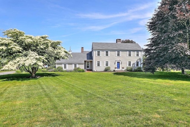 47 Fallon Dr, Westport, MA 02790 - colonial inspired home with a chimney and a front lawn