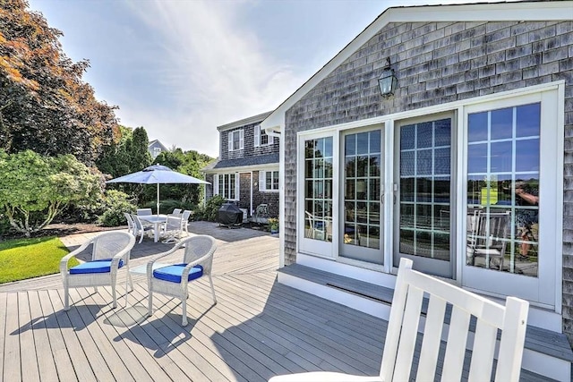 47 Fallon Dr, Westport, MA 02790 - wooden terrace with outdoor dining space