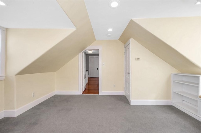 additional living space with vaulted ceiling, carpet flooring, recessed lighting, and baseboards