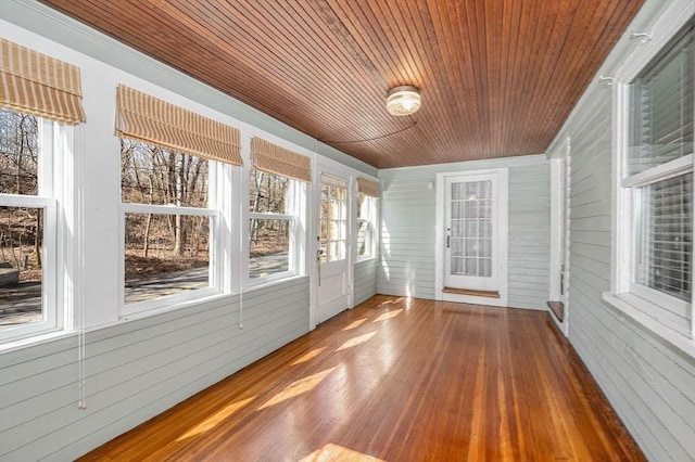 unfurnished sunroom with wooden ceiling