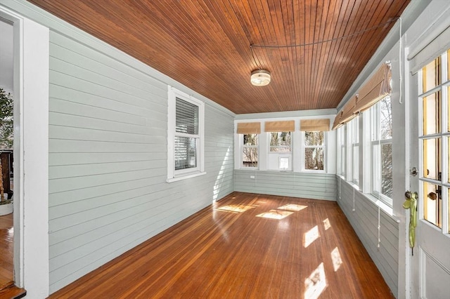 unfurnished sunroom featuring wooden ceiling