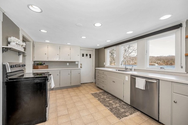 kitchen with a sink, stainless steel dishwasher, electric range oven, recessed lighting, and light countertops