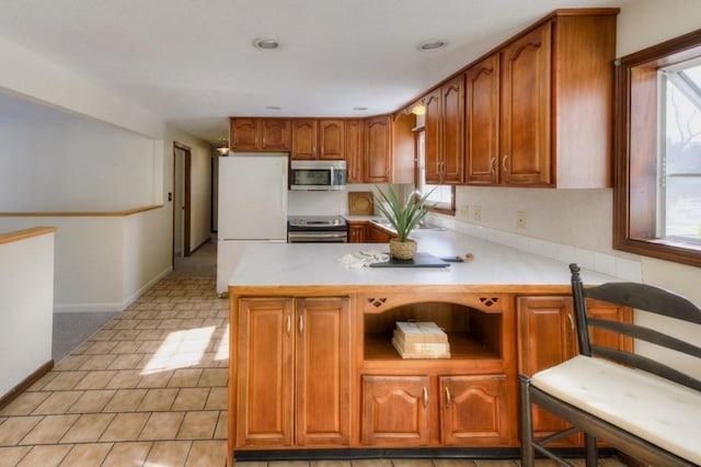 kitchen featuring stainless steel appliances and kitchen peninsula