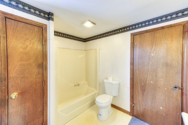 bathroom with shower / washtub combination and toilet