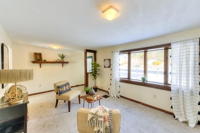 carpeted living room featuring a textured ceiling