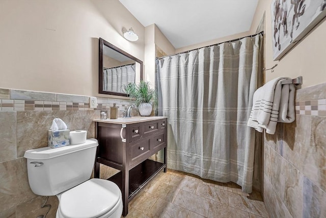 43 Kendall Ave Unit G03, Sherborn, MA 01770 - bathroom with tile walls, vanity, curtained shower, and a wainscoted wall