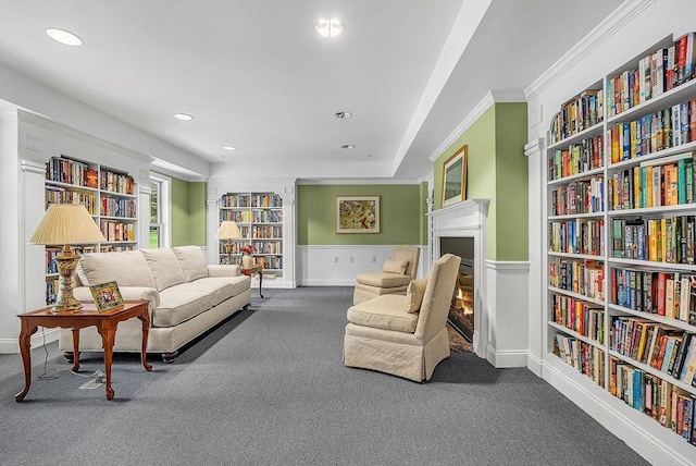 43 Kendall Ave Unit G03, Sherborn, MA 01770 - living area featuring carpet floors, built in features, a lit fireplace, recessed lighting, and ornamental molding