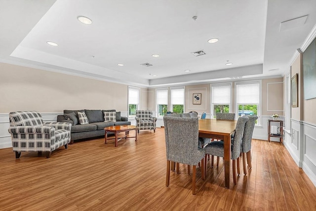 43 Kendall Ave Unit G03, Sherborn, MA 01770 - dining space featuring a raised ceiling, a decorative wall, wood finished floors, wainscoting, and recessed lighting
