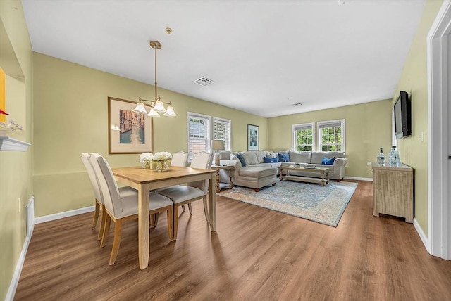 43 Kendall Ave Unit G03, Sherborn, MA 01770 - dining area featuring wood finished floors and a chandelier