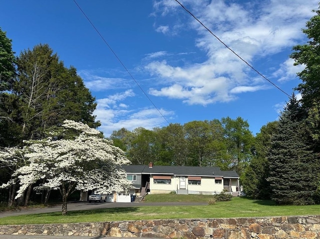 211 Stevens St, Marlborough, MA 01752 - view of front of house featuring a front lawn, driveway, and a garage
