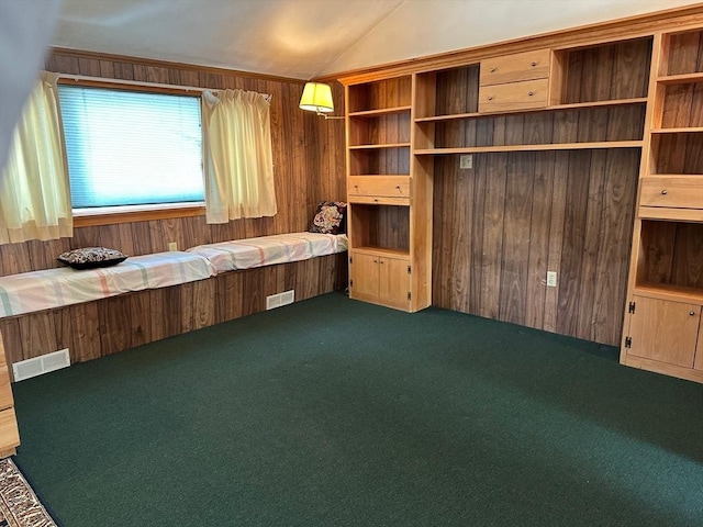 211 Stevens St, Marlborough, MA 01752 - unfurnished bedroom featuring carpet flooring, lofted ceiling, and wood walls