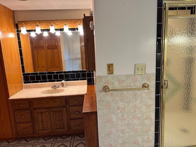 211 Stevens St, Marlborough, MA 01752 - bathroom with a shower stall, vanity, and backsplash