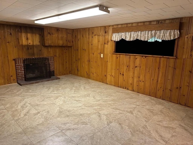 211 Stevens St, Marlborough, MA 01752 - unfurnished living room with wood walls and a fireplace