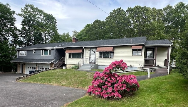 211 Stevens St, Marlborough, MA 01752 - ranch-style house featuring an attached garage, a front yard, a chimney, driveway, and entry steps