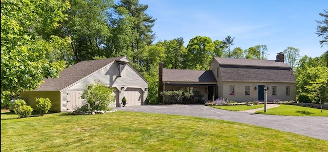 7 Stoney Hill Rd, Mattapoisett, MA 02739 - view of front facade with a chimney, a front lawn, asphalt driveway, an attached garage, and a gambrel roof