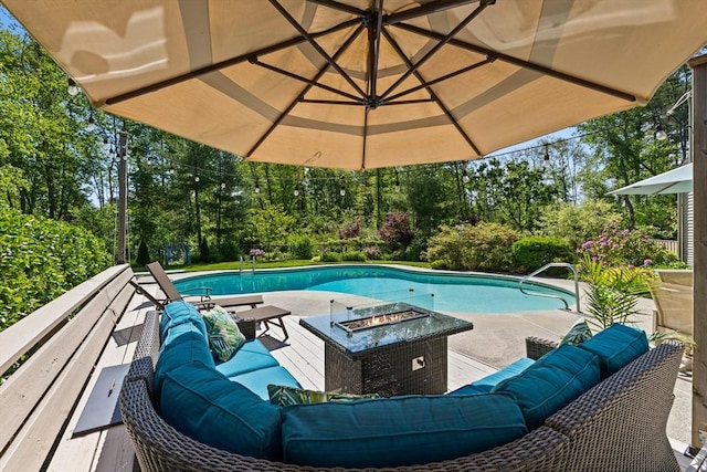 7 Stoney Hill Rd, Mattapoisett, MA 02739 - outdoor pool with an outdoor living space with a fire pit, view of scattered trees, and a patio area