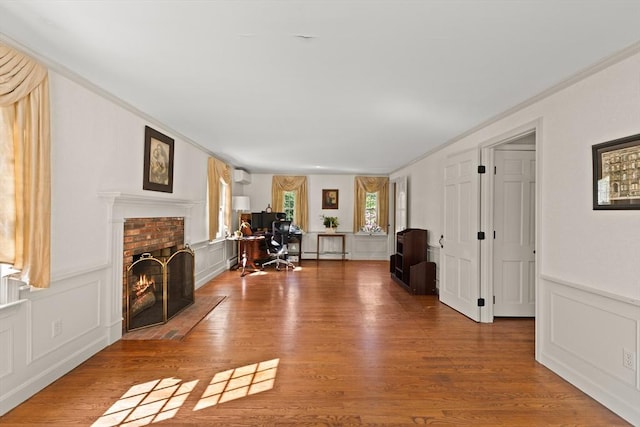 7 Stoney Hill Rd, Mattapoisett, MA 02739 - living area with a decorative wall, a fireplace, wood finished floors, a wainscoted wall, and a wall mounted AC