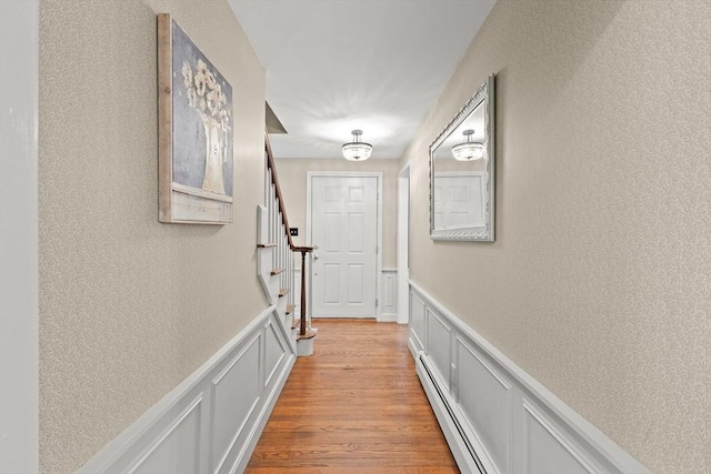 7 Stoney Hill Rd, Mattapoisett, MA 02739 - doorway with a decorative wall, baseboard heating, a wainscoted wall, stairs, and a textured wall