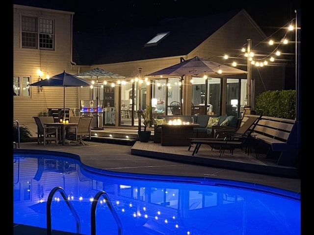 7 Stoney Hill Rd, Mattapoisett, MA 02739 - pool at twilight with a fire pit, an outdoor pool, and a deck