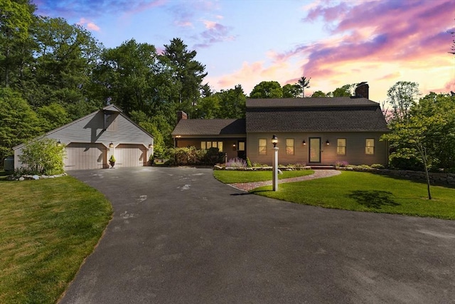 7 Stoney Hill Rd, Mattapoisett, MA 02739 - colonial inspired home featuring a chimney, an outbuilding, a lawn, driveway, and a detached garage