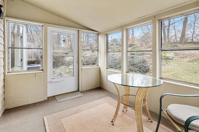 sunroom featuring lofted ceiling