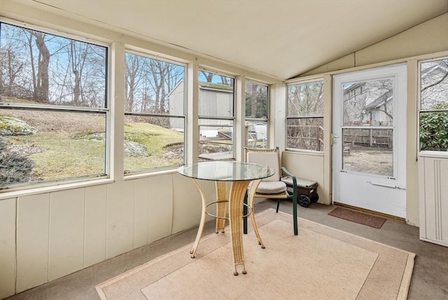 sunroom featuring vaulted ceiling