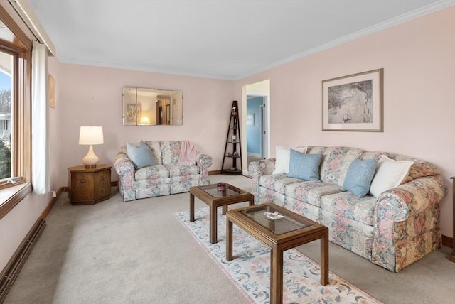 carpeted living room featuring baseboards and ornamental molding