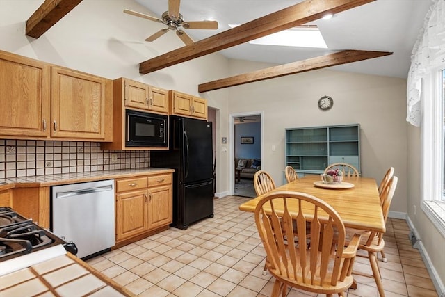 kitchen featuring tile countertops, light tile patterned floors, vaulted ceiling with beams, black appliances, and tasteful backsplash