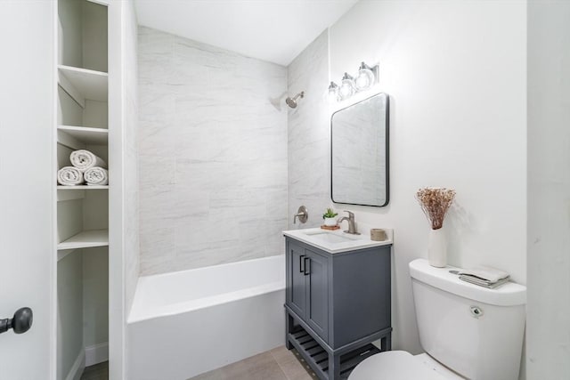 full bathroom with tiled shower / bath, vanity, and toilet