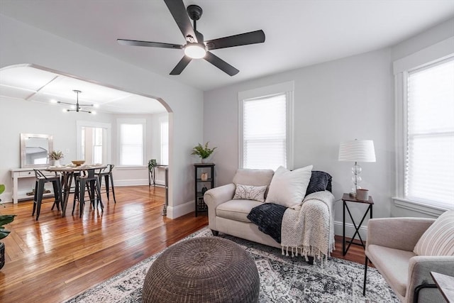 living room featuring hardwood / wood-style floors and ceiling fan