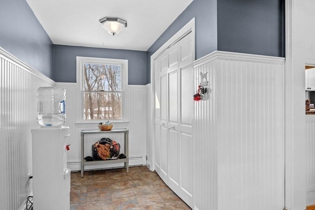 mudroom featuring a baseboard heating unit