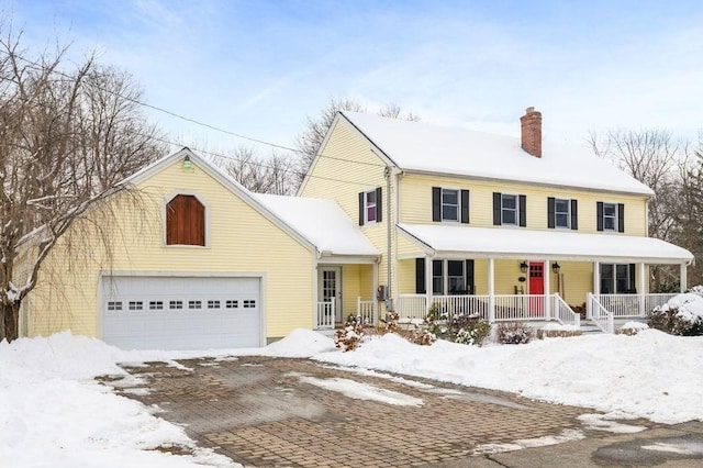 view of front of house featuring a porch and a garage