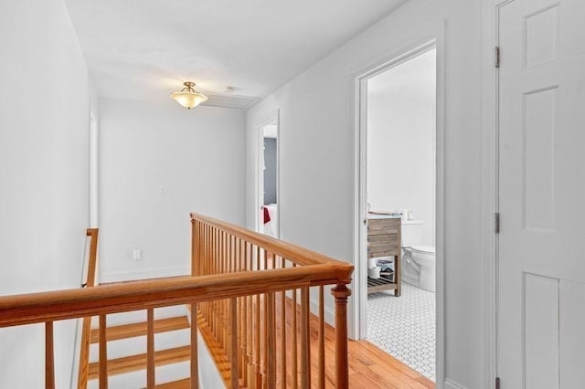 corridor with light hardwood / wood-style floors