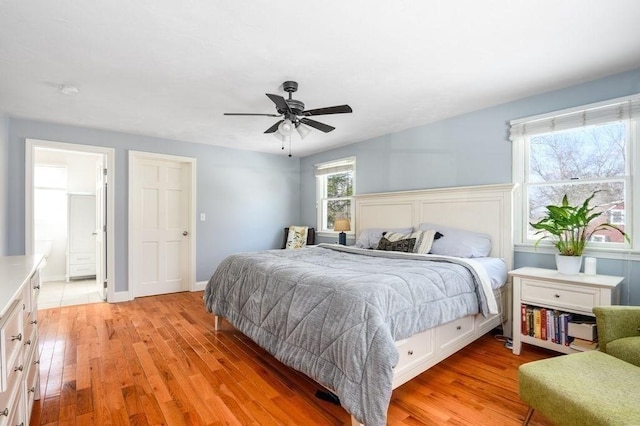 bedroom with ceiling fan and light hardwood / wood-style floors