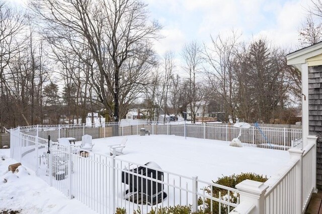 view of yard layered in snow