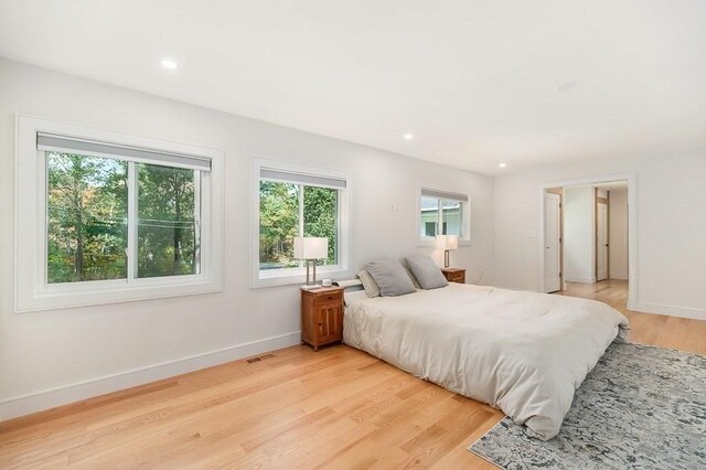 bedroom with light hardwood / wood-style floors