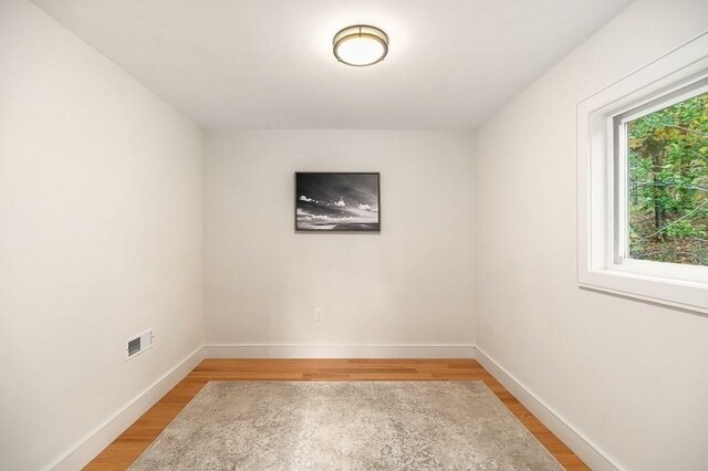 spare room with light wood-type flooring