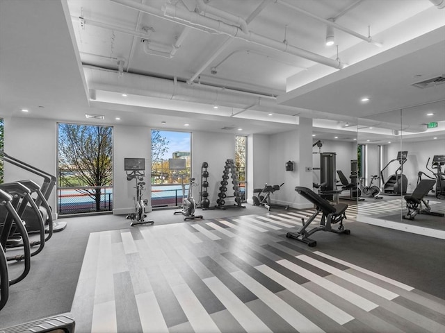 gym featuring recessed lighting, baseboards, and visible vents