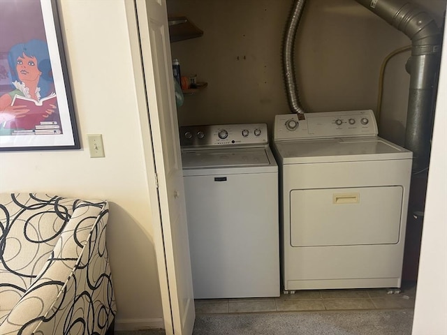 washroom with tile patterned floors and washer and dryer