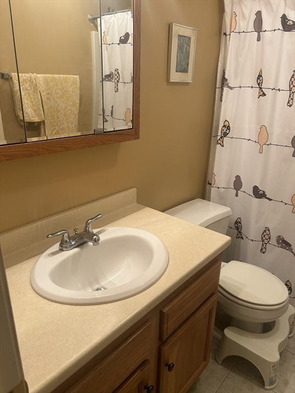 bathroom with toilet, tile patterned flooring, a shower with shower curtain, and vanity