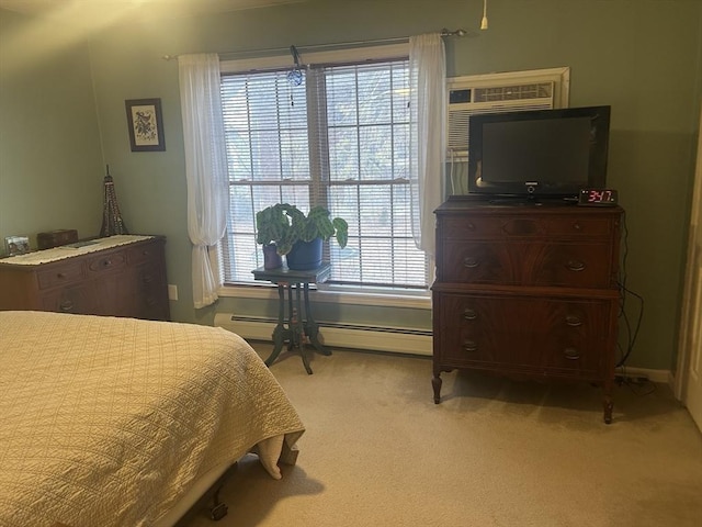 bedroom with a wall unit AC, baseboard heating, and light colored carpet